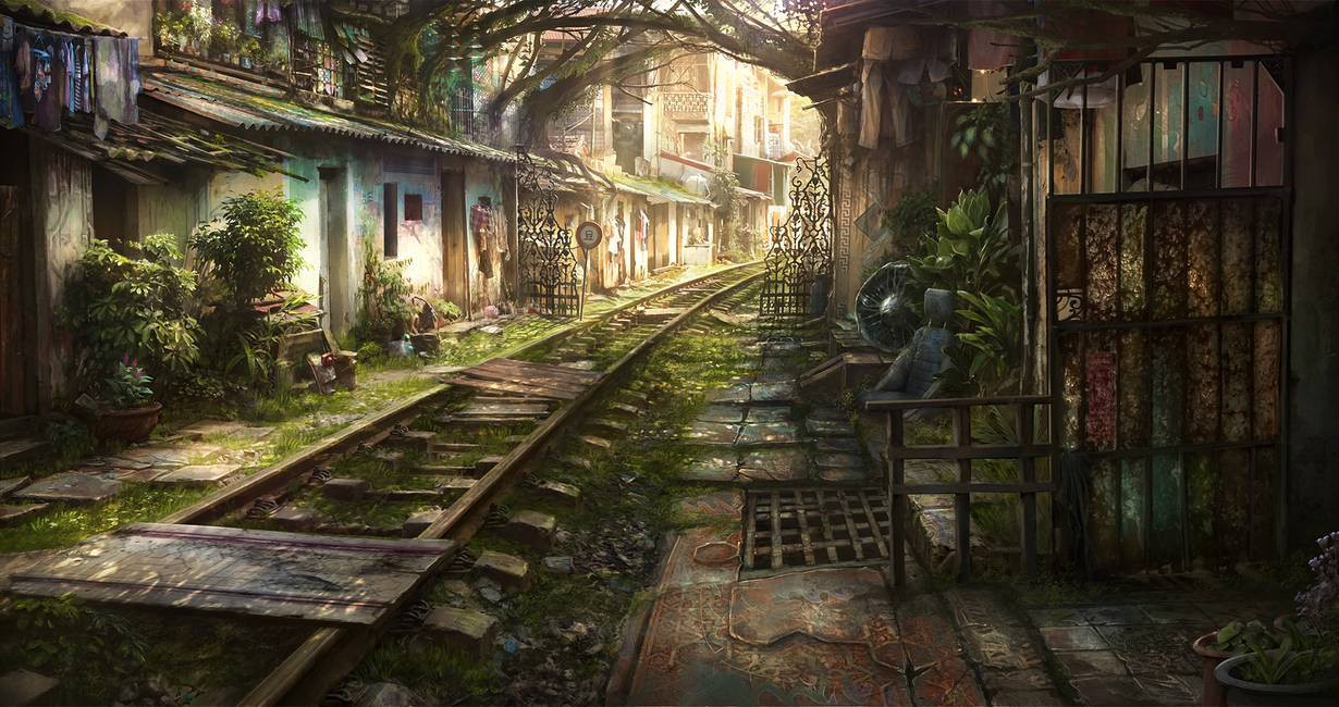 A weathered railroad track through a quiet village